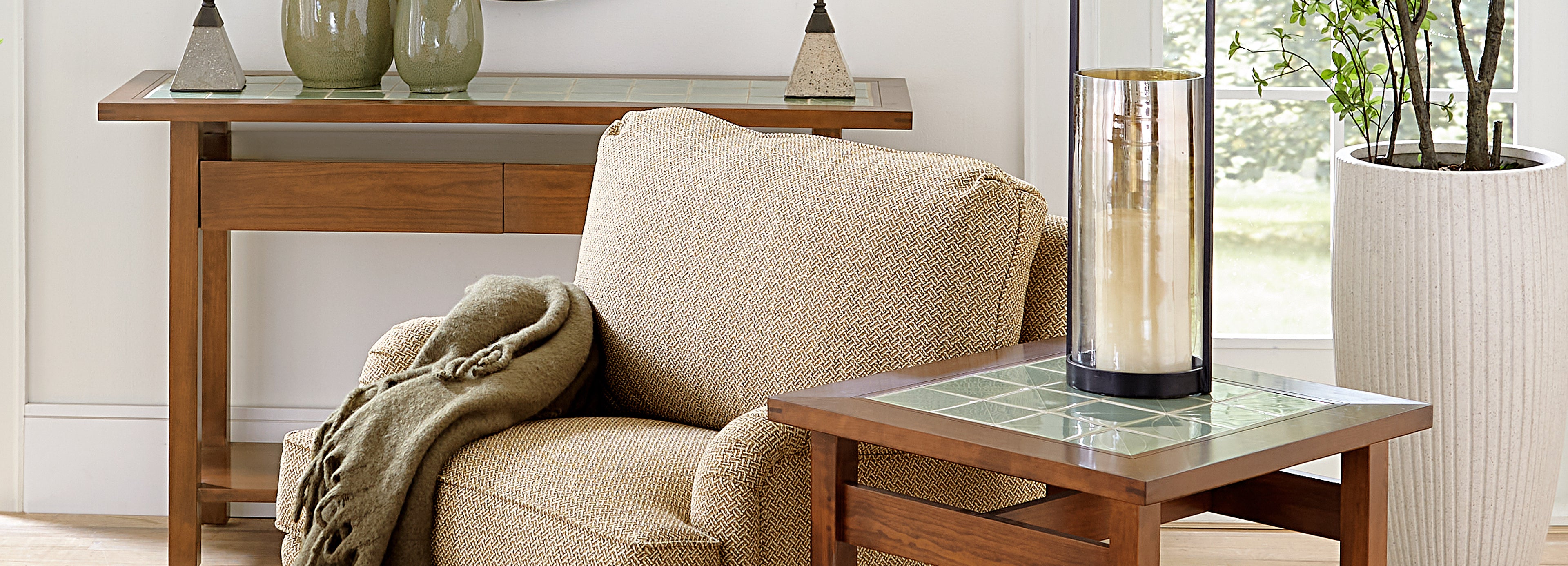 Stickley Mission Tile-Top end table and side table next to cream colored chair